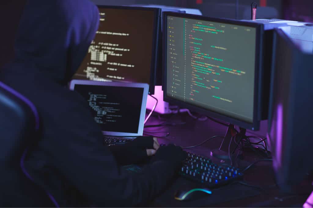Person coding in a dark environment